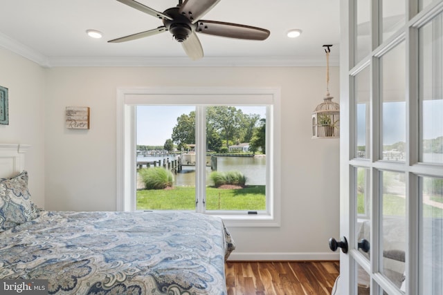 1045 Back Bay Beach Rd, West River, MD 20778 - bedroom featuring multiple windows, a water view, crown molding, wood finished floors, and ceiling fan