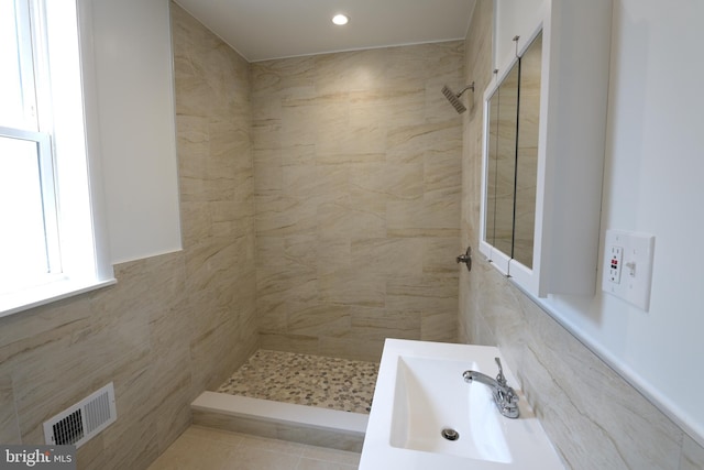 2420 N Reese St, Philadelphia, PA 19133 - bathroom featuring tiled shower and tile walls
