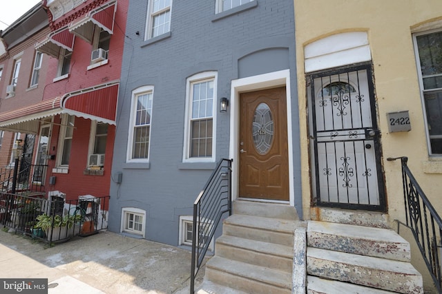 2420 N Reese St, Philadelphia, PA 19133 - doorway to property featuring brick siding and cooling unit