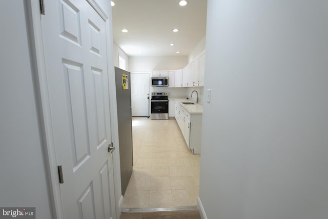 2420 N Reese St, Philadelphia, PA 19133 - hallway featuring light tile patterned floors and recessed lighting