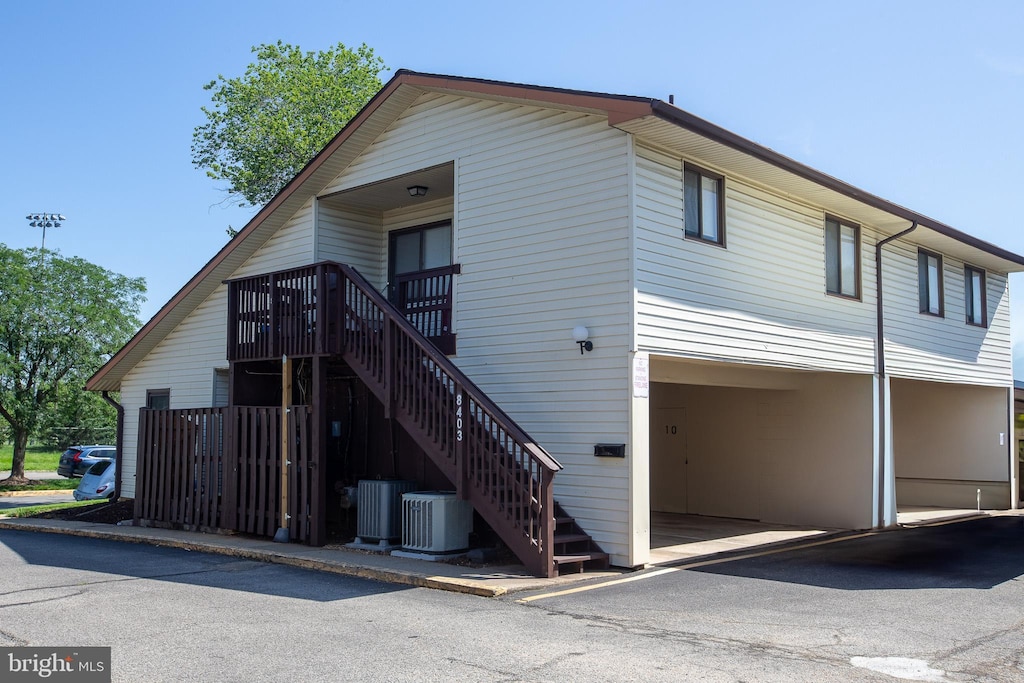 8403 Credos Ct Unit 10, Alexandria, VA 22309 - rear view of house featuring a garage and stairs