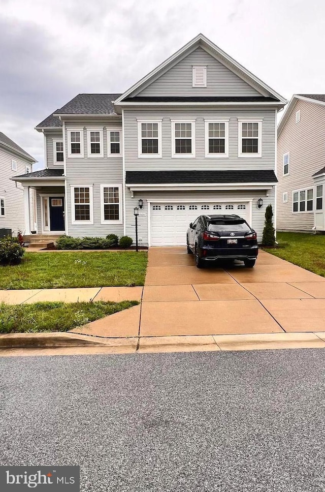 4564 Shakespeare Cir, White Plains, MD 20695 - view of front facade featuring a garage, driveway, and a front lawn