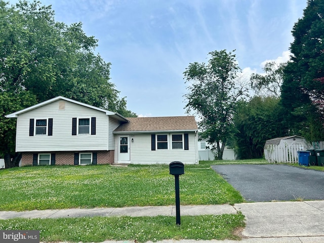 7287 Shirley Dr, Easton, MD 21601 - split level home featuring a shed, a front lawn, and driveway