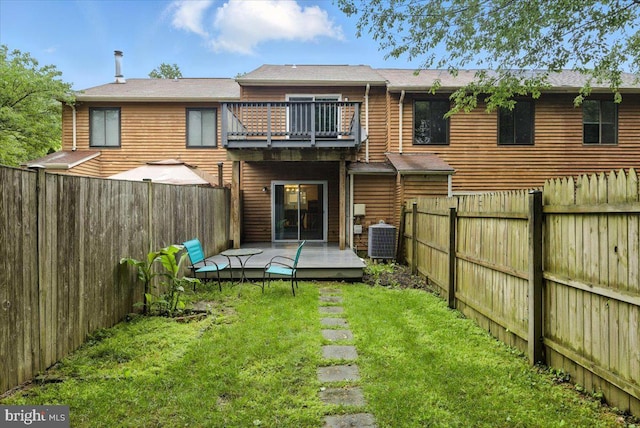 1348 Hazel Nut Ct, Annapolis, MD 21409 - rear view of house featuring a balcony, a fenced backyard, and a wooden deck
