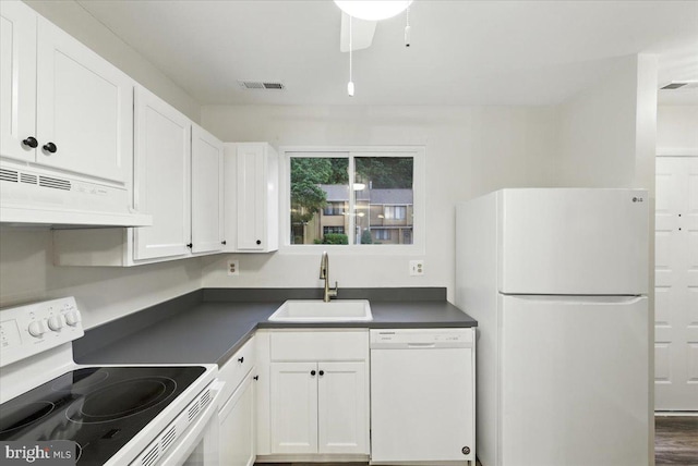 1348 Hazel Nut Ct, Annapolis, MD 21409 - kitchen with white appliances, under cabinet range hood, dark countertops, and white cabinetry