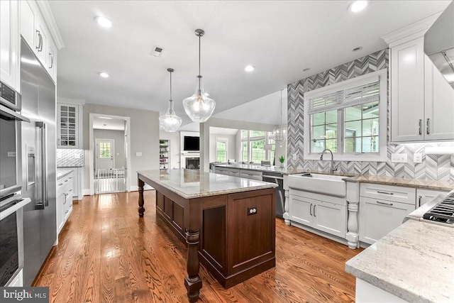 203 Geist View Cir, Media, PA 19063 - kitchen with appliances with stainless steel finishes, decorative backsplash, light stone counters, dark wood-style floors, and recessed lighting