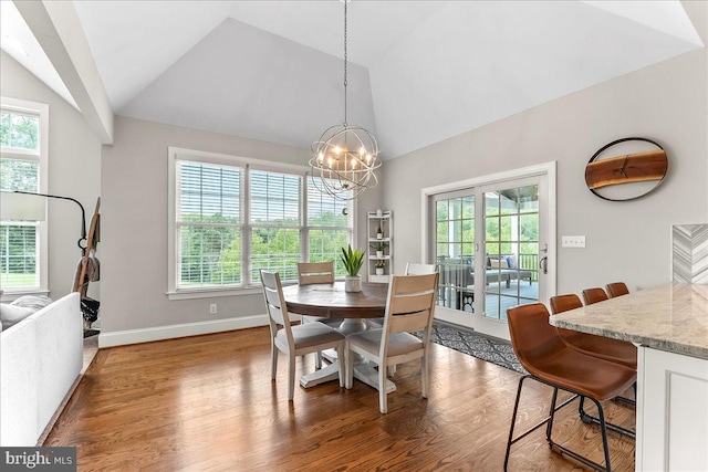 203 Geist View Cir, Media, PA 19063 - dining space with a chandelier, healthy amount of natural light, wood finished floors, and high vaulted ceiling