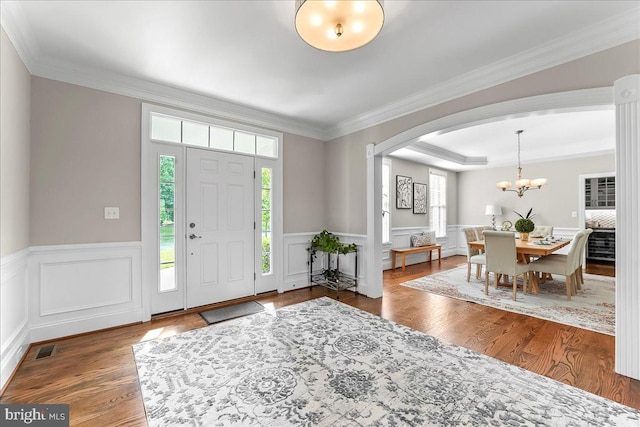203 Geist View Cir, Media, PA 19063 - entrance foyer featuring arched walkways, plenty of natural light, a chandelier, wood finished floors, and ornamental molding