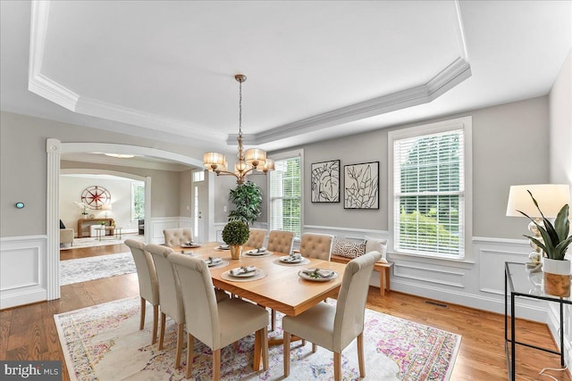 203 Geist View Cir, Media, PA 19063 - dining area featuring a tray ceiling, arched walkways, a chandelier, a wainscoted wall, and ornamental molding
