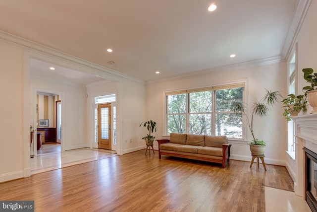 1829 47th Pl NW, Washington, DC 20007 - living room featuring light wood-style floors, a fireplace, recessed lighting, and ornamental molding
