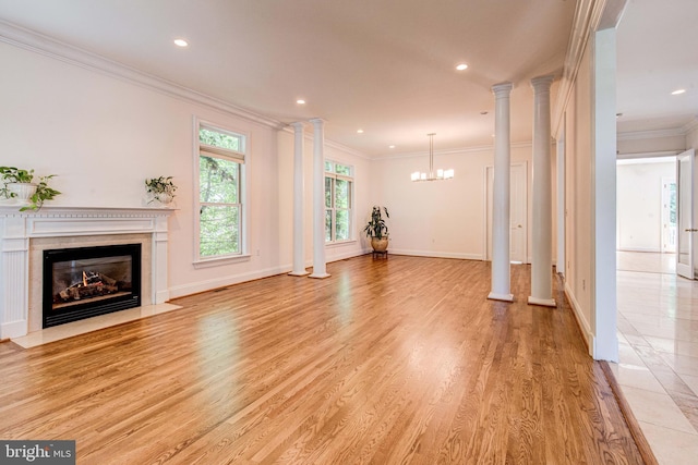 1829 47th Pl NW, Washington, DC 20007 - unfurnished living room with a fireplace with flush hearth, light wood-style floors, crown molding, a chandelier, and recessed lighting