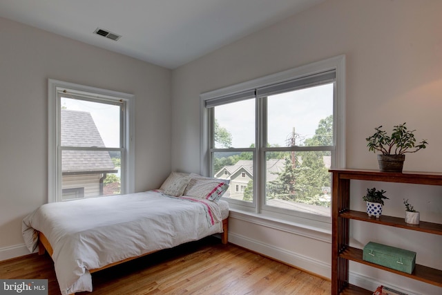 1829 47th Pl NW, Washington, DC 20007 - bedroom with baseboards and light wood-type flooring