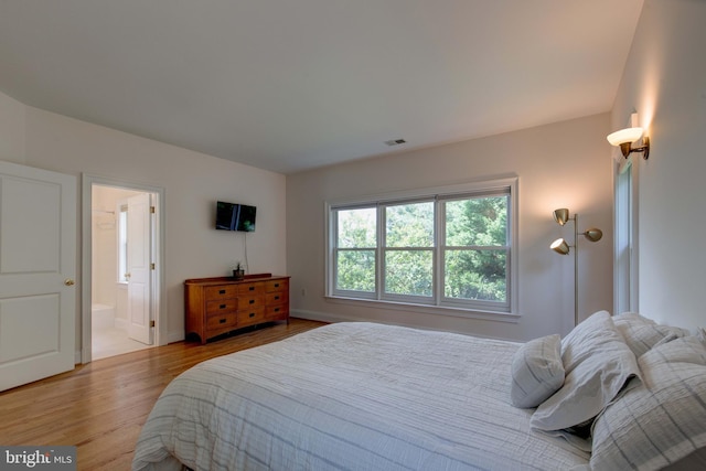 1829 47th Pl NW, Washington, DC 20007 - bedroom with light wood-type flooring and ensuite bathroom