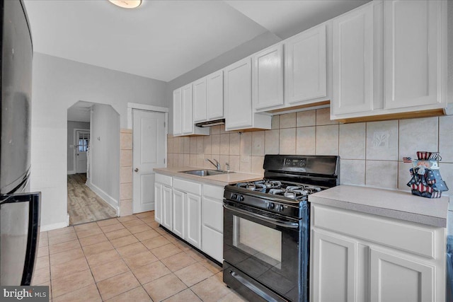 521 Bergen St, Gloucester City, NJ 08030 - kitchen featuring gas stove, light countertops, and white cabinets