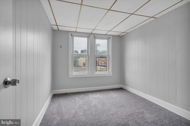 521 Bergen St, Gloucester City, NJ 08030 - carpeted spare room featuring a paneled ceiling and wood walls
