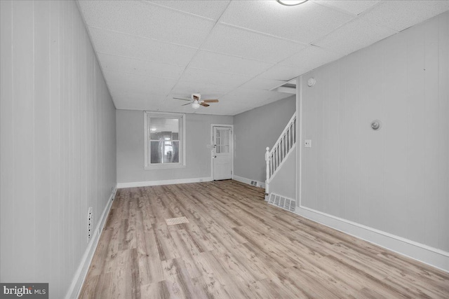 521 Bergen St, Gloucester City, NJ 08030 - unfurnished living room with wood finished floors, stairway, a ceiling fan, and a drop ceiling