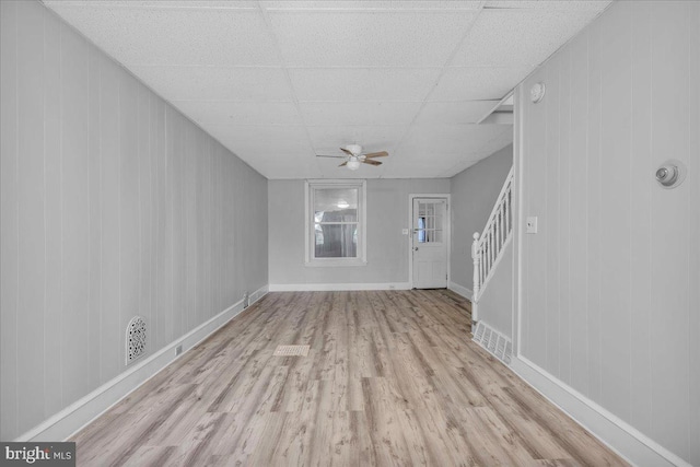 521 Bergen St, Gloucester City, NJ 08030 - unfurnished living room featuring wood finished floors, ceiling fan, stairway, and a drop ceiling