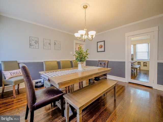 121 Wayne Ave, Springfield, PA 19064 - dining area with crown molding, a chandelier, and wood finished floors