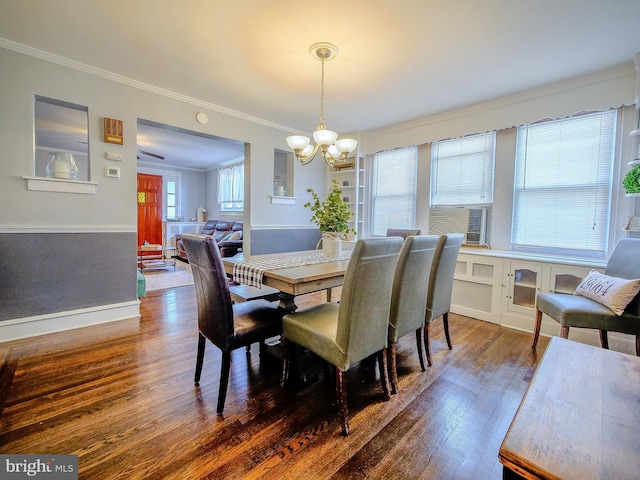 121 Wayne Ave, Springfield, PA 19064 - dining space featuring a chandelier, dark wood-style floors, crown molding, and cooling unit