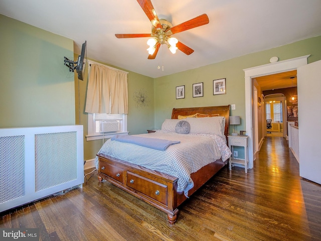 121 Wayne Ave, Springfield, PA 19064 - bedroom with radiator, cooling unit, wood finished floors, and a ceiling fan