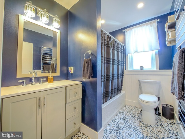 121 Wayne Ave, Springfield, PA 19064 - full bath featuring vanity, shower / bathtub combination with curtain, tile patterned flooring, a wainscoted wall, and recessed lighting