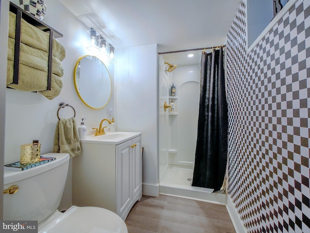 121 Wayne Ave, Springfield, PA 19064 - bathroom featuring a stall shower, vanity, recessed lighting, wood finished floors, and wallpapered walls