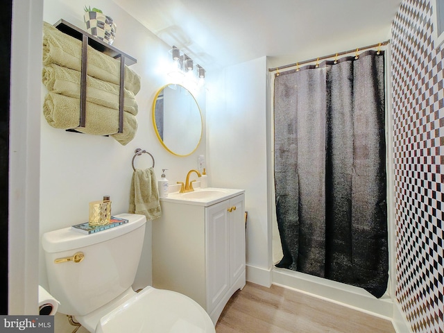 121 Wayne Ave, Springfield, PA 19064 - full bath featuring wood finished floors, vanity, and a shower stall
