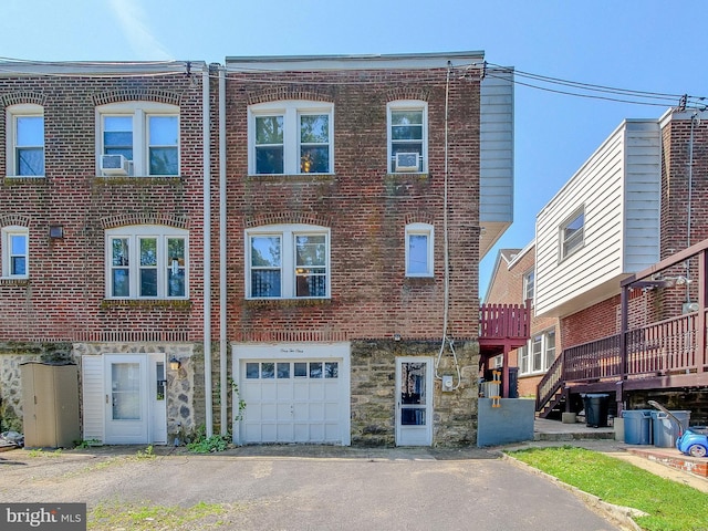 121 Wayne Ave, Springfield, PA 19064 - view of front of property featuring an attached garage, brick siding, driveway, and stone siding
