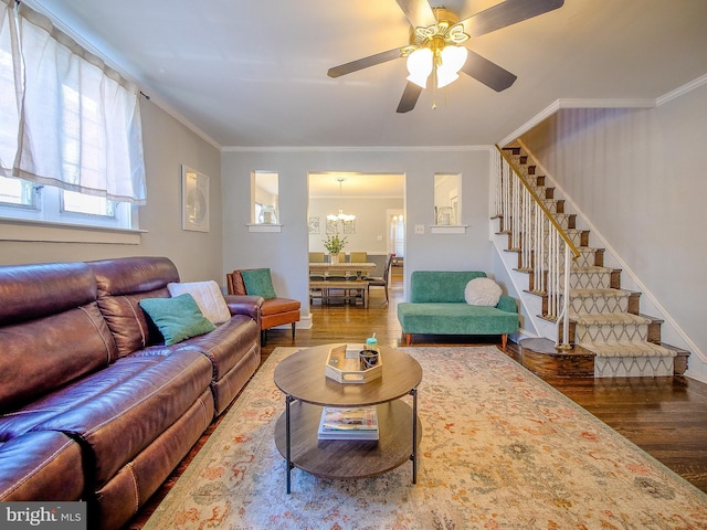 121 Wayne Ave, Springfield, PA 19064 - living area with wood finished floors, stairway, healthy amount of natural light, crown molding, and a ceiling fan