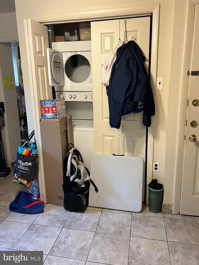 1220 Pine St, Philadelphia, PA 19107 - laundry room with stacked washer / drying machine and light tile patterned floors