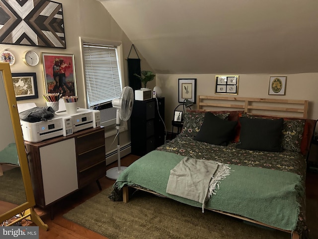 1220 Pine St, Philadelphia, PA 19107 - bedroom with a baseboard radiator, wood finished floors, and lofted ceiling