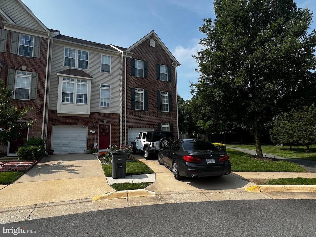 4107 Cressida Pl, Woodbridge, VA 22192 - view of front of property featuring an attached garage, driveway, and brick siding