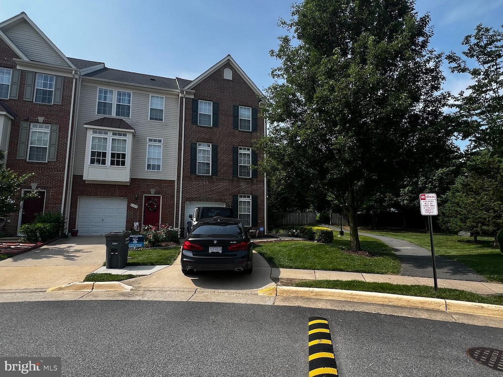 4107 Cressida Pl, Woodbridge, VA 22192 - multi unit property featuring a garage, concrete driveway, and brick siding