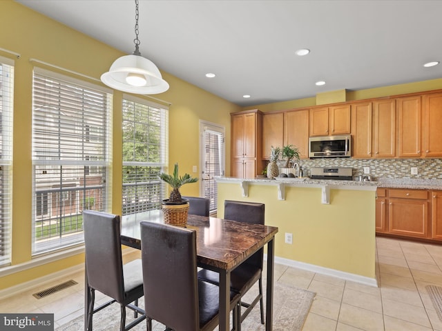 43559 Wheadon Ter, Chantilly, VA 20152 - dining area with plenty of natural light, light tile patterned floors, and recessed lighting