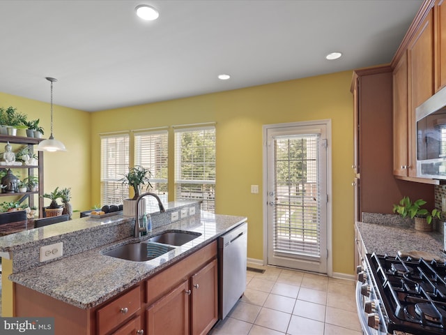 43559 Wheadon Ter, Chantilly, VA 20152 - kitchen with stainless steel appliances, a kitchen island with sink, light tile patterned flooring, pendant lighting, and light stone countertops