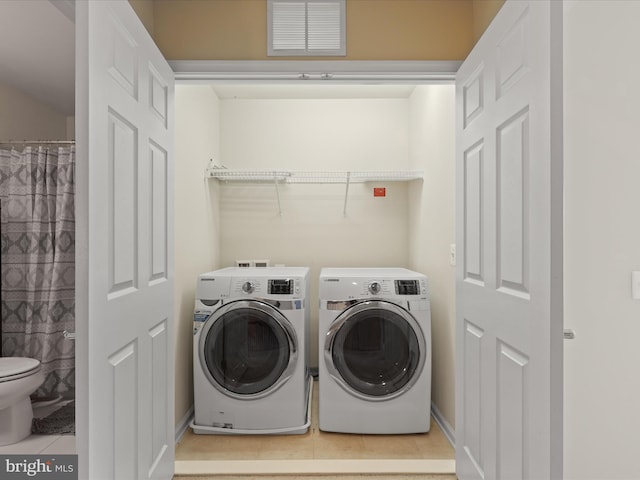 43559 Wheadon Ter, Chantilly, VA 20152 - washroom with light tile patterned flooring and washer and clothes dryer