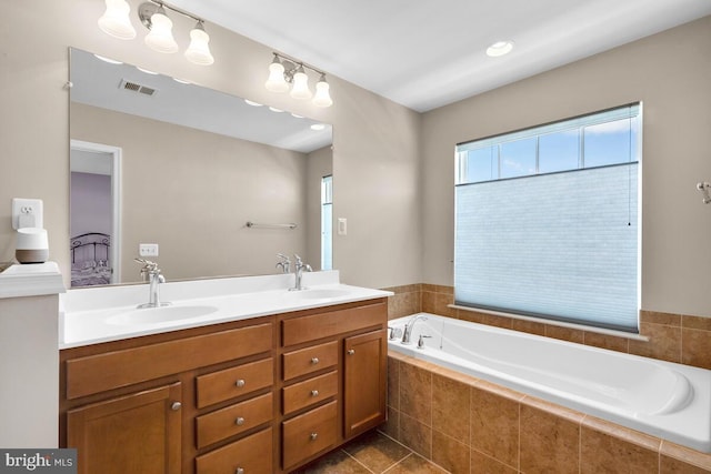 43559 Wheadon Ter, Chantilly, VA 20152 - full bathroom with plenty of natural light, a bath, double vanity, and tile patterned flooring