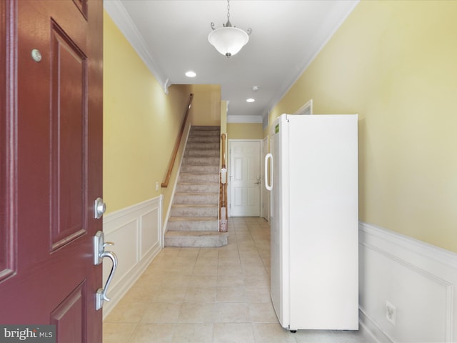 43559 Wheadon Ter, Chantilly, VA 20152 - foyer featuring crown molding, stairs, light tile patterned floors, and wainscoting