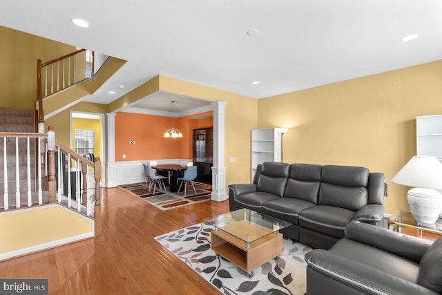 43559 Wheadon Ter, Chantilly, VA 20152 - living room with ornate columns, stairway, wood finished floors, wainscoting, and recessed lighting