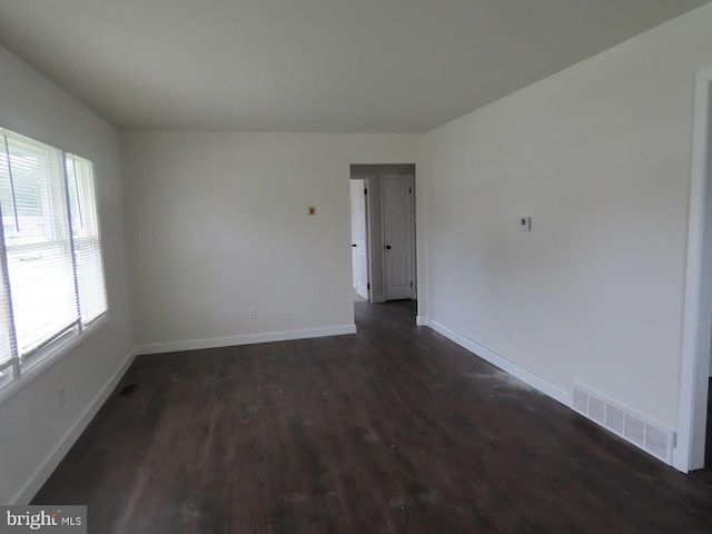 32 Stevens Ave, New Castle, DE 19720 - spare room featuring baseboards and dark wood-type flooring