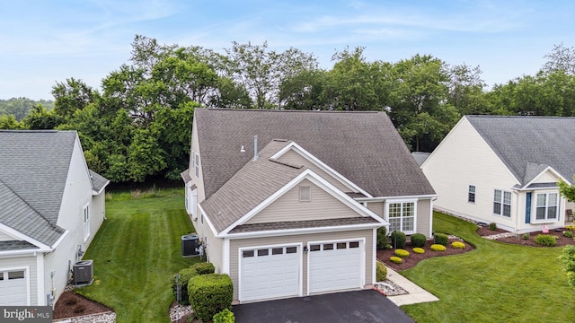 343 Daylilly Way, Middletown, DE 19709 - traditional home featuring asphalt driveway, a front yard, a garage, and roof with shingles