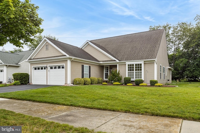 343 Daylilly Way, Middletown, DE 19709 - view of front of property with a garage, asphalt driveway, a front yard, and roof with shingles