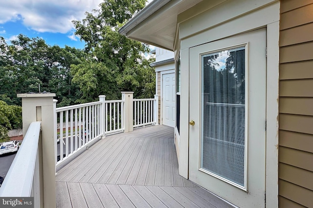12915 Alton Sq Unit 307, Herndon, VA 20170 - wooden deck with view of wooded area
