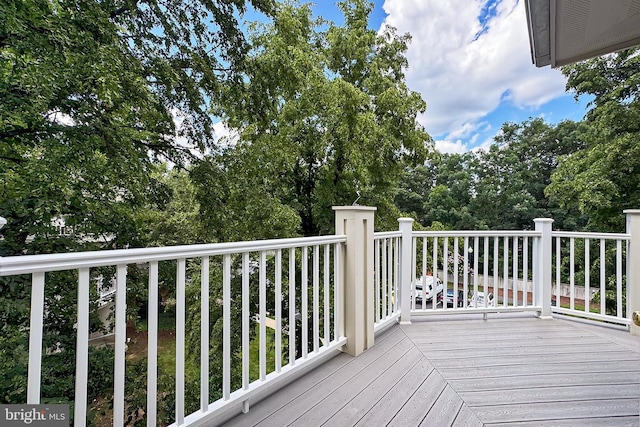 12915 Alton Sq Unit 307, Herndon, VA 20170 - wooden terrace featuring view of wooded area
