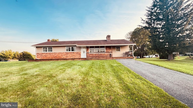 2323 Flag Marsh, Mount Airy, MD 21771 - ranch-style house featuring a chimney, brick siding, and a front yard