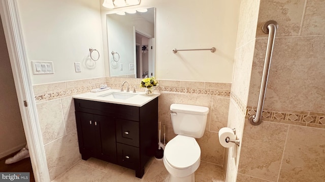 2323 Flag Marsh, Mount Airy, MD 21771 - bathroom featuring tile walls, vanity, and wainscoting