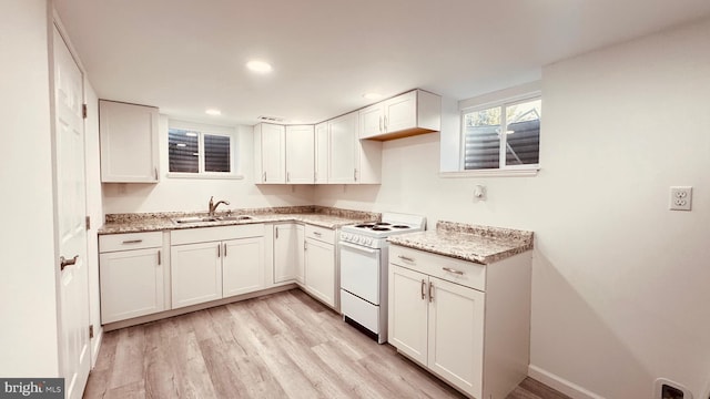 2323 Flag Marsh, Mount Airy, MD 21771 - kitchen with white electric range, light wood-type flooring, white cabinetry, light stone countertops, and recessed lighting