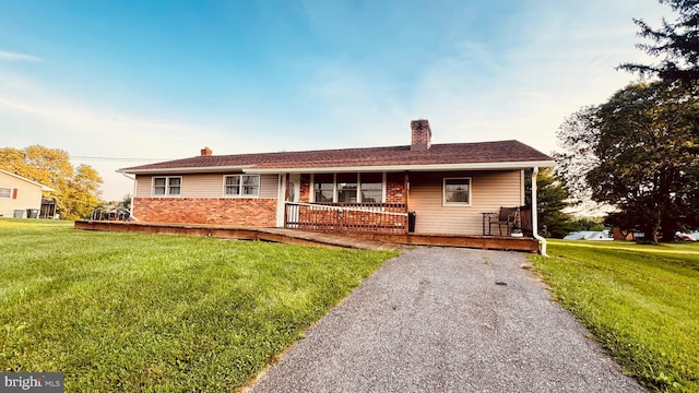 2323 Flag Marsh, Mount Airy, MD 21771 - view of front of house with a chimney, a porch, and a front lawn