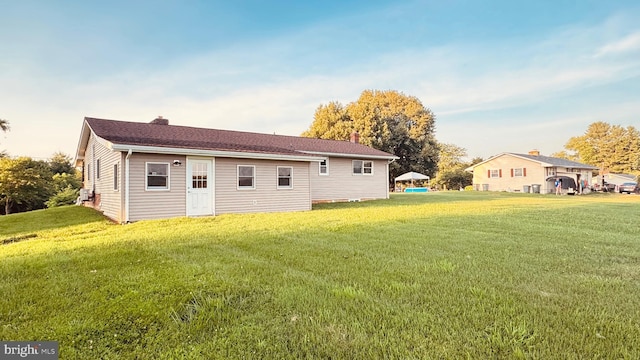 2323 Flag Marsh, Mount Airy, MD 21771 - rear view of property featuring a lawn and a chimney