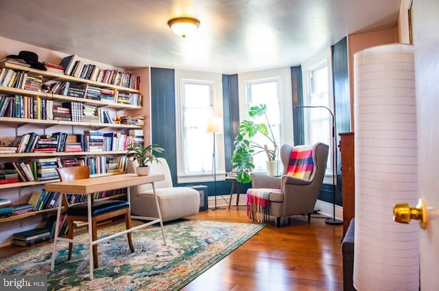 713 E 23rd St, Baltimore, MD 21218 - living area with hardwood / wood-style floors and baseboards